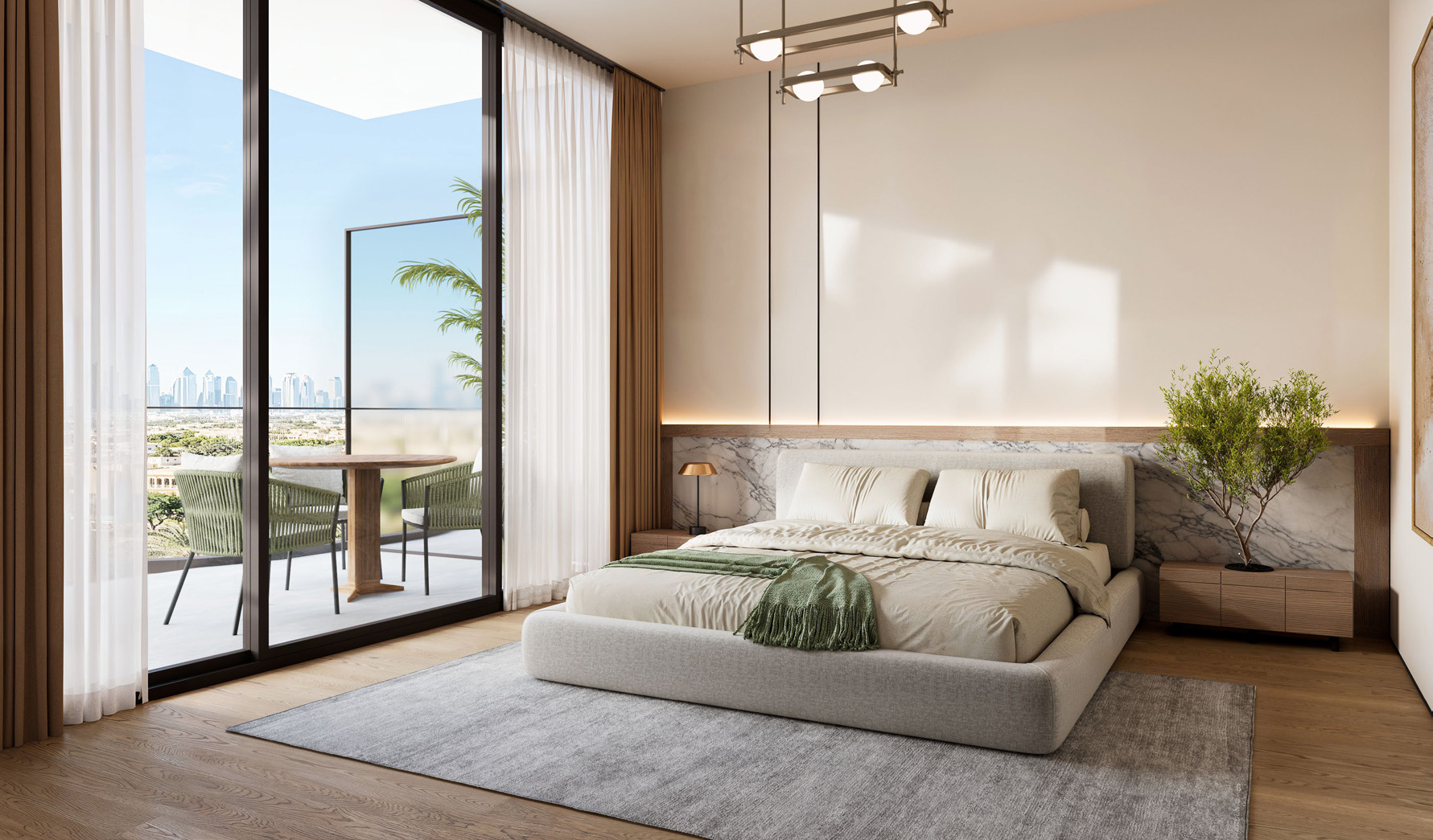 Master bedroom opening onto a balcony with a table and chairs