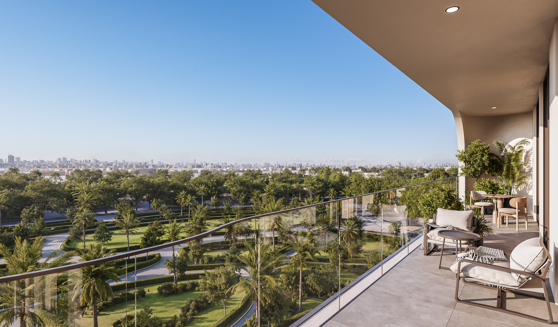 Wide balcony with armchairs overlooking green parkland and the skyline